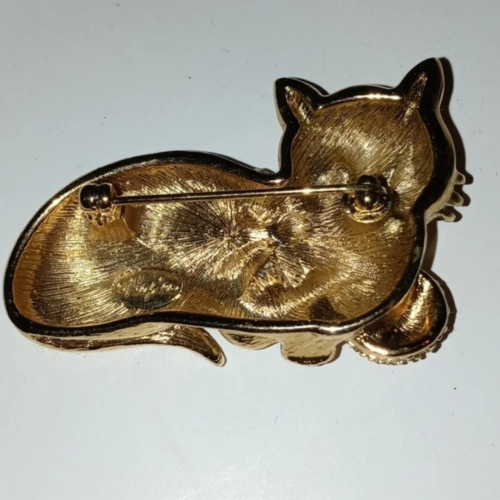Napier cat brooch with emerald green jewel eyes and crystal stone ball